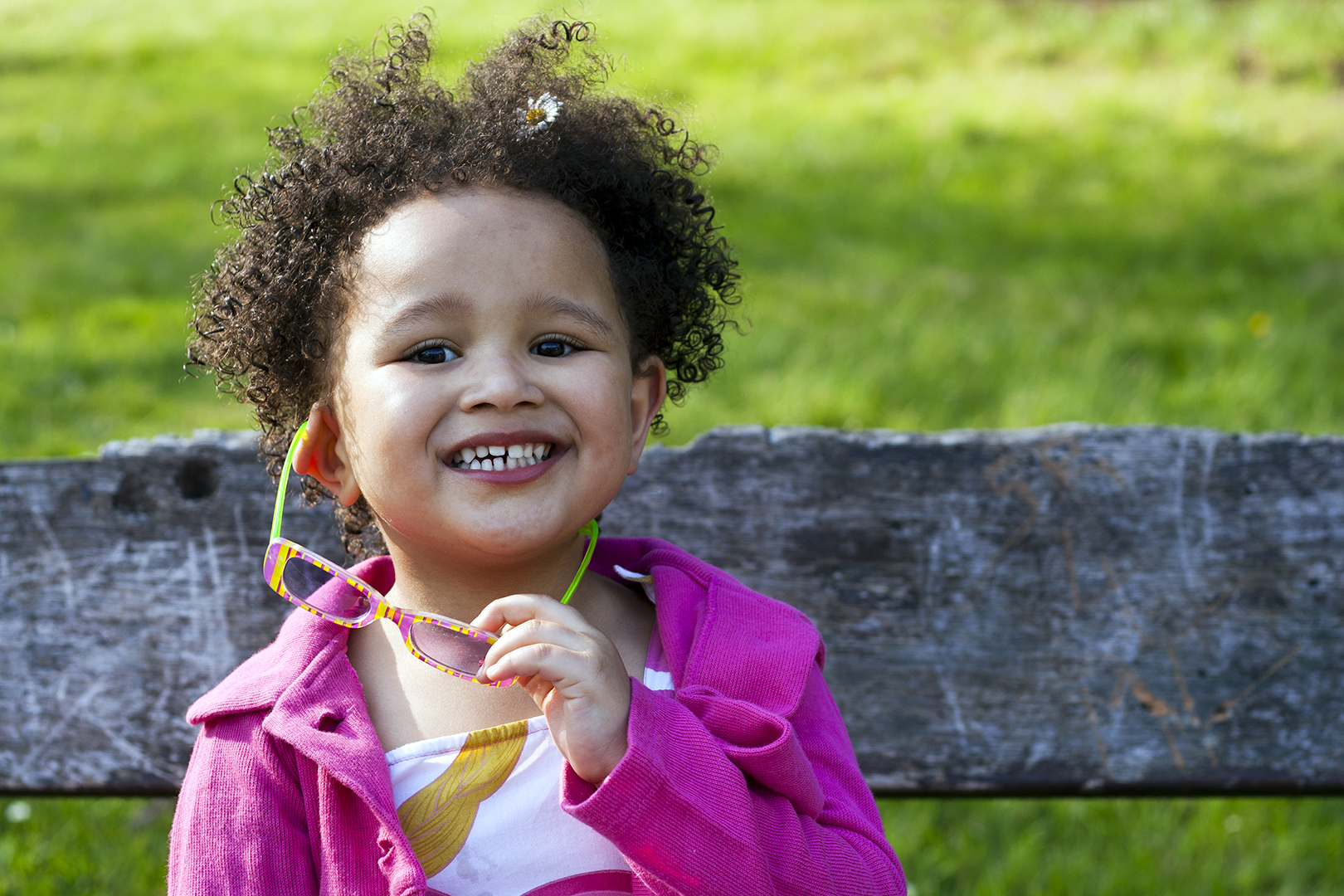 Young black baby girl with glasses smiling Depositphotos xl